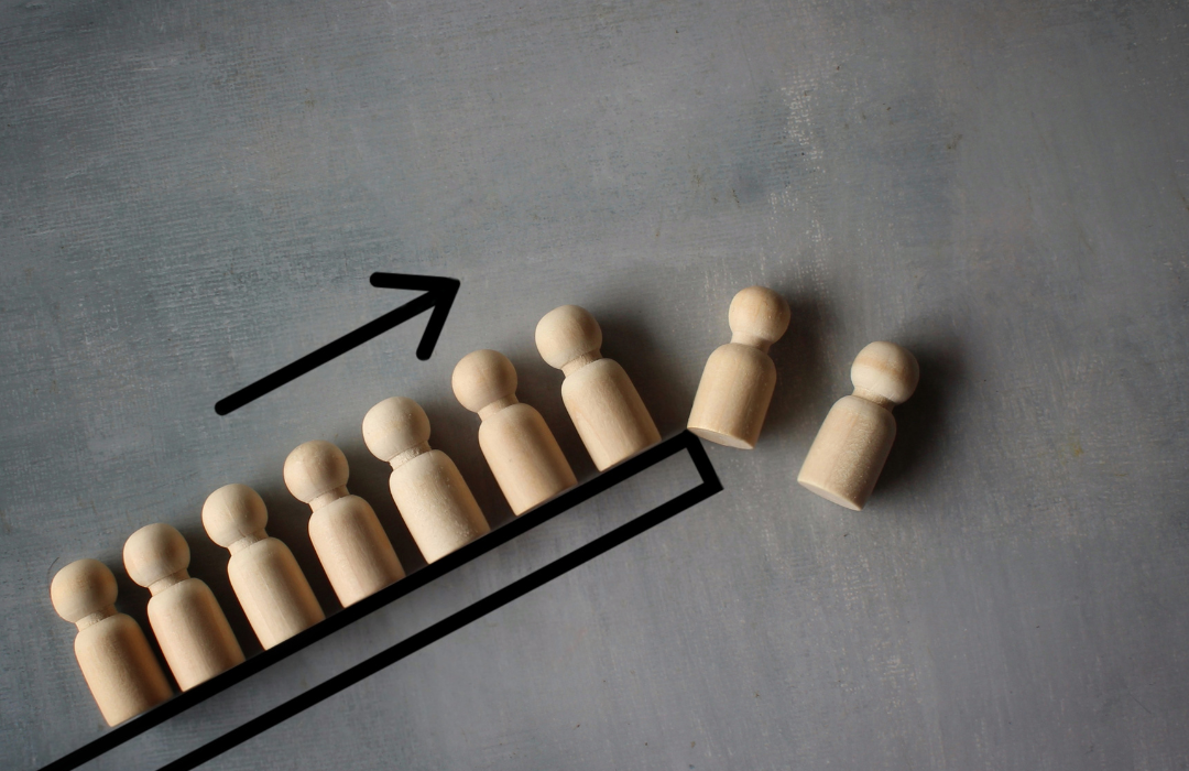alt="wooden people representation with upward arrow-Project HR Support"